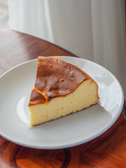 Burnt Basque Cheesecake. A slice of cheese cake with burnt cake