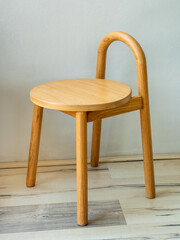 Wooden stool in natural color and simple design.