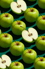 Pattern of green apples on a solid green background