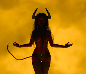 Illustration of a female demon devil sucubuss with horns and a tail posing with her arms outstretched against a fiery background
 - obrazy, fototapety, plakaty