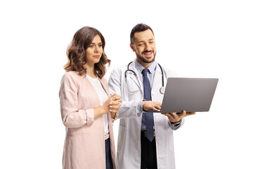 Male doctor and a woman patient looking at a laptop computer