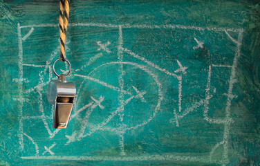 Whistle of soccer referee or trainer  and grungy tactics scribble  on grunge  background. Great...
