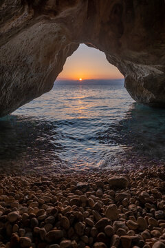 Kako Lagadi cave against sun rising on the horizon, Kefalonia, Greece