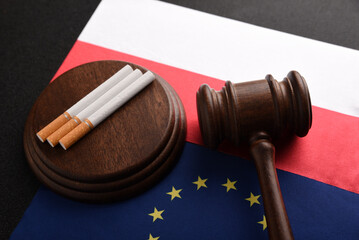 Illegal trade in cigarettes between Poland and the EU countries. Cigarettes and Judge gavel on...