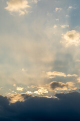 Fototapeta na wymiar Dramatic sunset sky. The rays of the sun at sunset. Cloudy sky with sun rays.