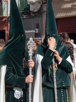 Nazarenos con b&aacute;culos met&aacute;licos. Semana Santa / Nazarenes with metal staffs. Holy Week. Sevilla. Andaluc&iacute;a