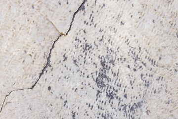 Cracked antique marble texture. Weather-cracked stone wall. Marble stone texture