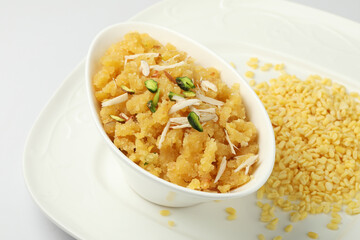 Moong dal halwa is a classic Indian sweet dish made with moong lentils, sugar, ghee and cardamom powder