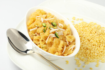 Moong dal halwa is a classic Indian sweet dish made with moong lentils, sugar, ghee and cardamom powder