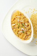 Moong dal halwa is a classic Indian sweet dish made with moong lentils, sugar, ghee and cardamom powder