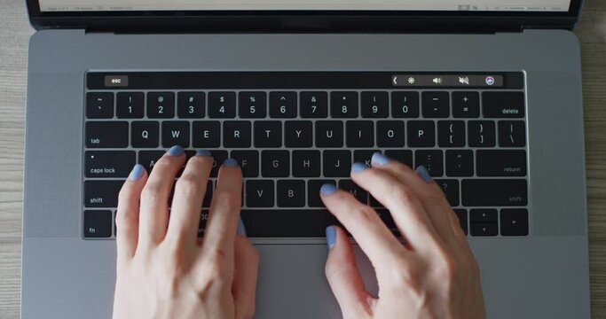 Straight Down Woman's Hands Typing On Keyboard