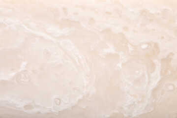 Background Stone wall, background with abstract stains of epoxy resin. Beautiful texture of marble and granite with stains, onyx surface. Finishing stone for furniture and interior. Acrylic stains