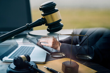 Obraz premium Judge gavel and legal book on wooden table, justice and law concept