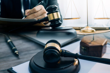 Judge gavel and legal book on wooden table, justice and law concept