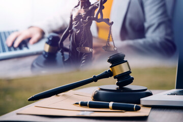 Judge gavel and legal book on wooden table, justice and law concept
