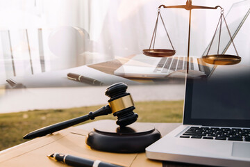 Judge gavel and legal book on wooden table, justice and law concept