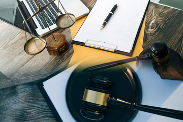 Judge gavel and legal book on wooden table, justice and law concept