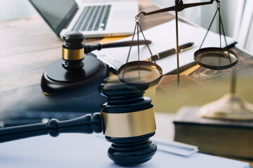 Obraz premium Judge gavel and legal book on wooden table, justice and law concept