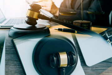Judge gavel and legal book on wooden table, justice and law concept