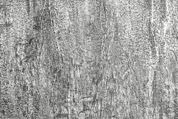 Obraz premium Gray background of decorative plaster with abstract spots. Unusual silver wall texture with beautiful patterns, creative surface background. Dressing coating for building cladding.