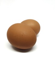 Two chicken eggs isolated on white background