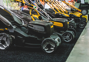 Assortment of Lawnmowers on display at a garden supply shop.