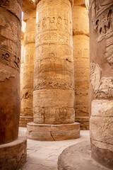 Different columns with hieroglyphs in Karnak temple. Karnak temple is the largest complex in ancient Egypt.
