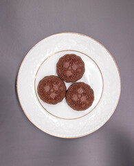 biscuit in a plate over on black background