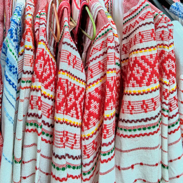 Traditional Russian folk bright patterns on woven clothes.Close-up