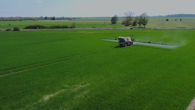 Crop Sprayer, Tractor. Using Pesticide On The Summer Crops. Filmed East Yorkshire. England. UK. 