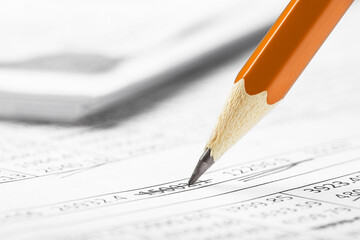 Accounting document with pencil and checking financial chart. Concept of banking, financial report and financial audit.