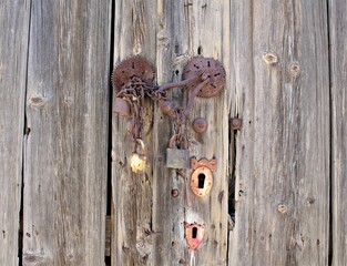 Old rusty door lock and knocker. Selected focus.