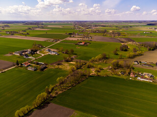 Spring fields, meadows and villages seen from a bird's eye view on a sunny, clear day. Spring.