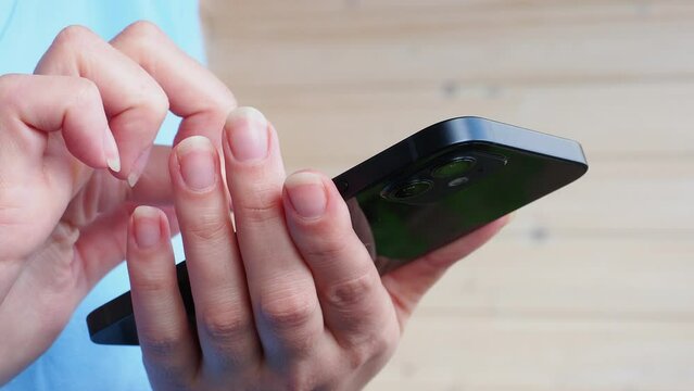 female hands use iPhone 12