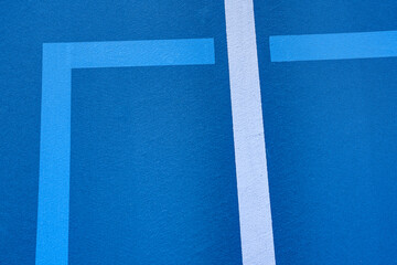 Fototapeta na wymiar Example of light blue pickleball lines on blue tennis court.