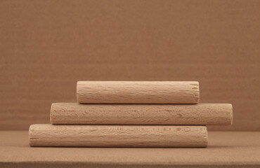Wooden eco rustic platform podium on beige background. Minimal empty display product presentation scene.