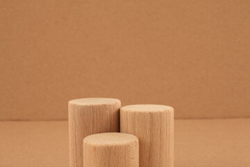 Wooden eco rustic platform podium on beige background. Minimal empty display product presentation scene.