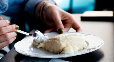 Turkish and Arabic Traditional Ramadan Dessert Tavuk Gogsu or Chicken Breast Milk, Girl Eating Dessert
