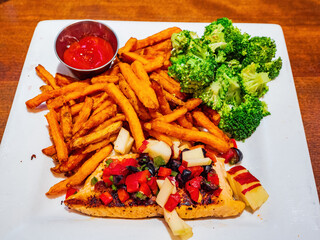 Close up shot of deep fried Sweet potatos and fried salmon