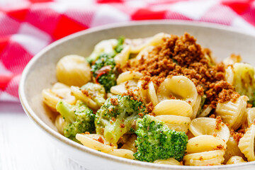 orequette pasta with broccoli on a white background