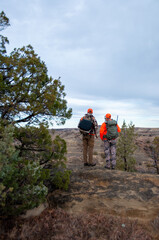 Hunters in the midwest North Dakota Badlands overlooking a valley for deer