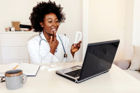 African-American Female Speech Teacher Hold Speech Therapy Session With Students Online, Teaches Pronunciation And Language Difficulties, Using Laptop. Speech Therapist Conducts An Online Lesson.