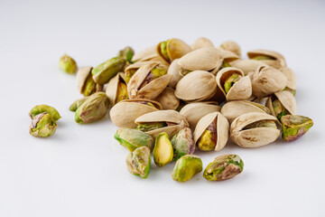 fresh salted pistachios on a white background