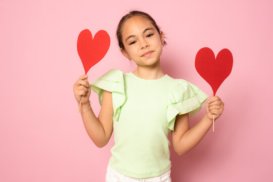 Love, Happiness And People Concept - Smiling Little Girl With Red Hearts