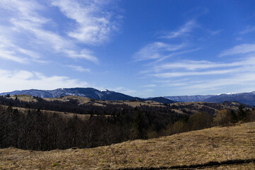 Scenic view of mountains and blue sky at background.