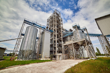 Metal elevator (grain silo) in agriculture zone. Grain Warehouse or depository is an important part of harvesting. Сorn, wheat and other crops are stored in it