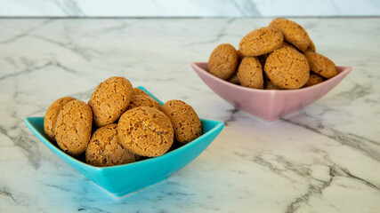 Amaretti cookies in bowl. Small soft Italian traditional sweet-bitter pastry dessert.