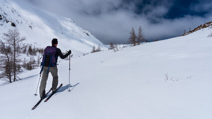 Fototapeta na wymiar Man springtime backcountry skiing in the Chics-Chocs Mountains, Quebec, Canada