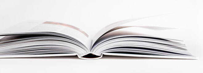 Open book with turning pages. Education, reading hobby concept. Encyclopedia, textbook. High quality photo