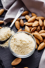 almond flour on a black wooden rustic background